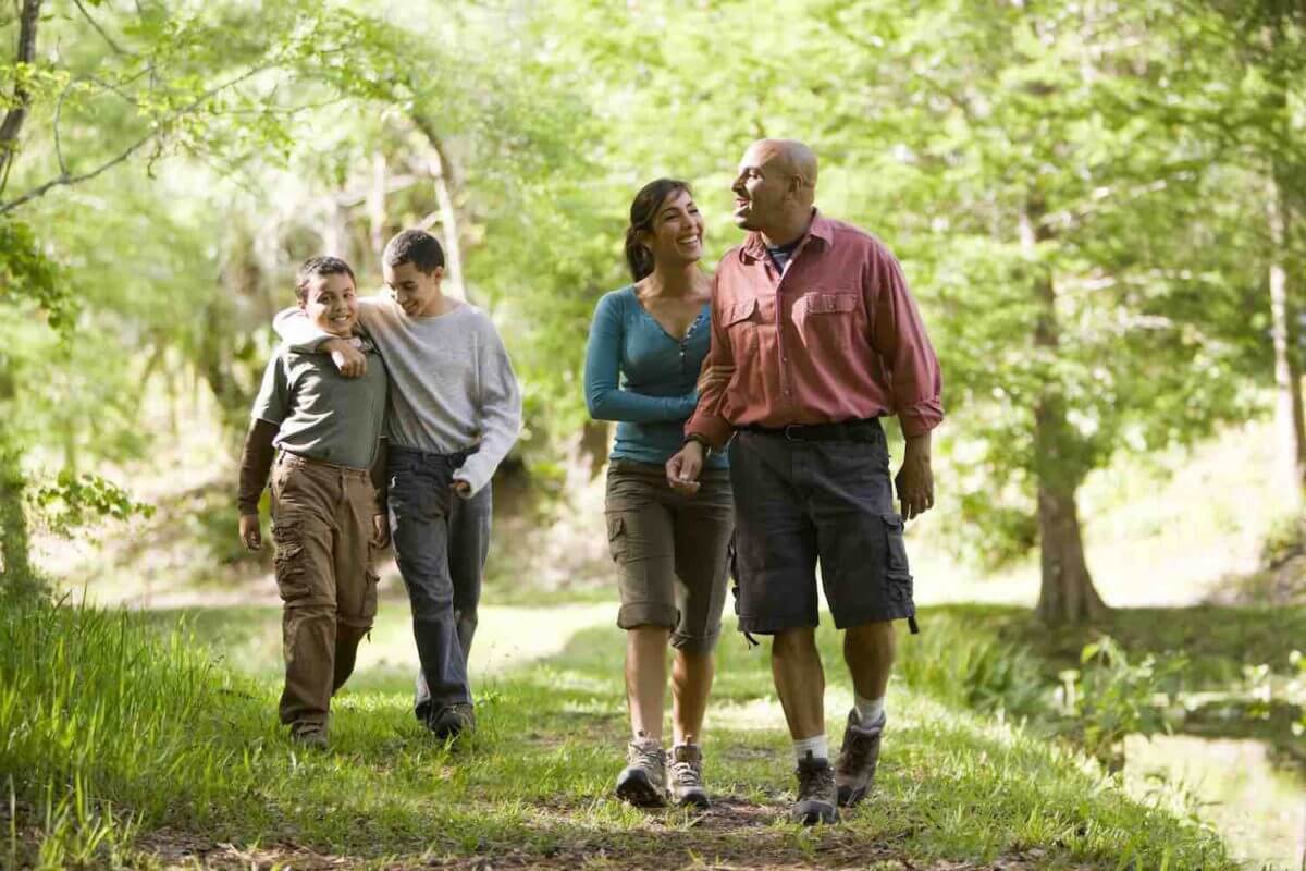 picture of couples walking a wooded path